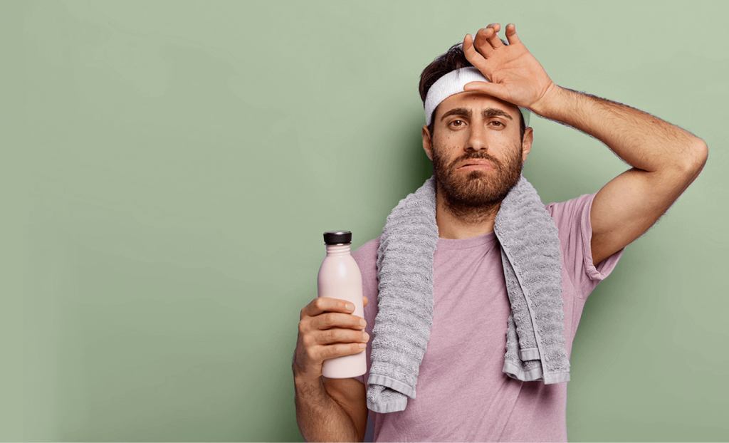 A man looking confused and tired after a workout.