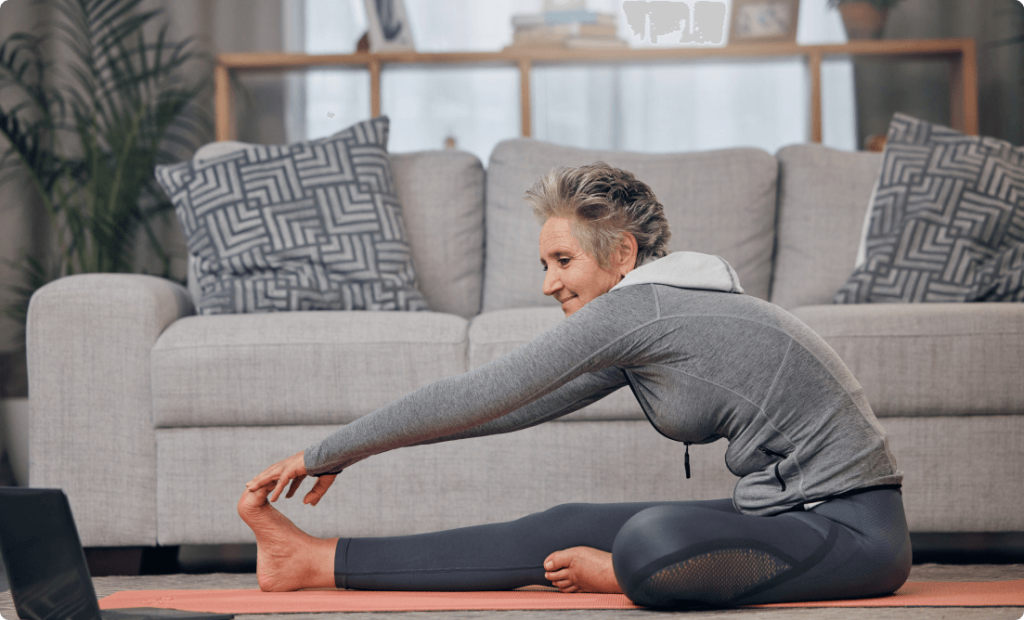 A girl doing cool down exercise in her lounge during winters