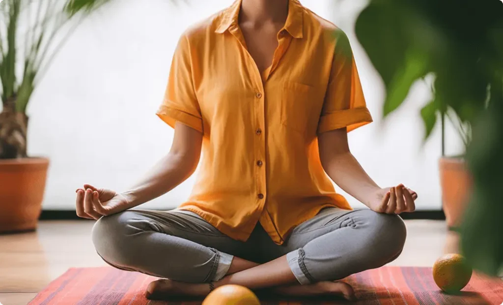 A girl doing yoga pose to relax and rejuvenate at Vision Sports Club.