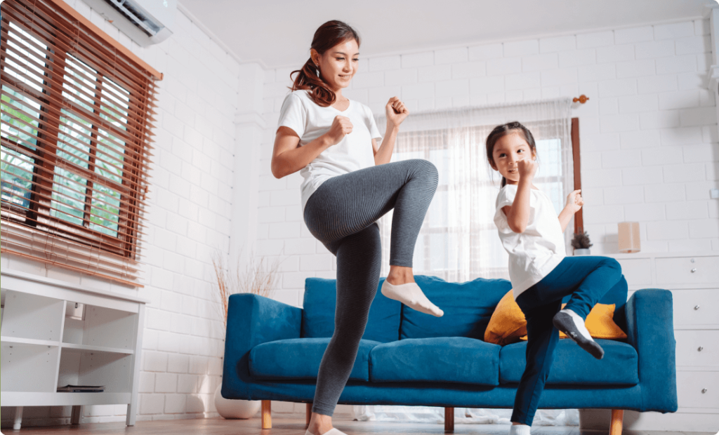 A mother and kid doing dance workout and promoting family's back to school fitness routine