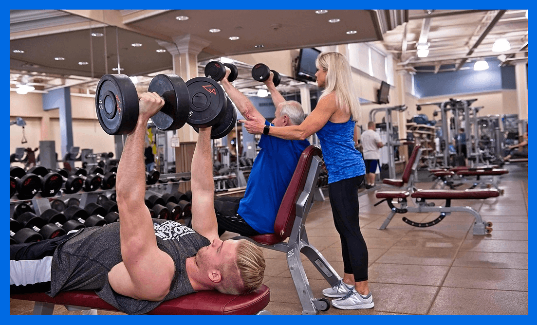Trainer Mary Mileo coaching clients through strength training exercises in at Vision Elite Training.