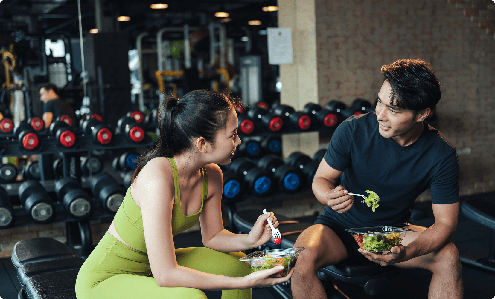 Women eating a high protein meal after strength training at Vision Elite gym