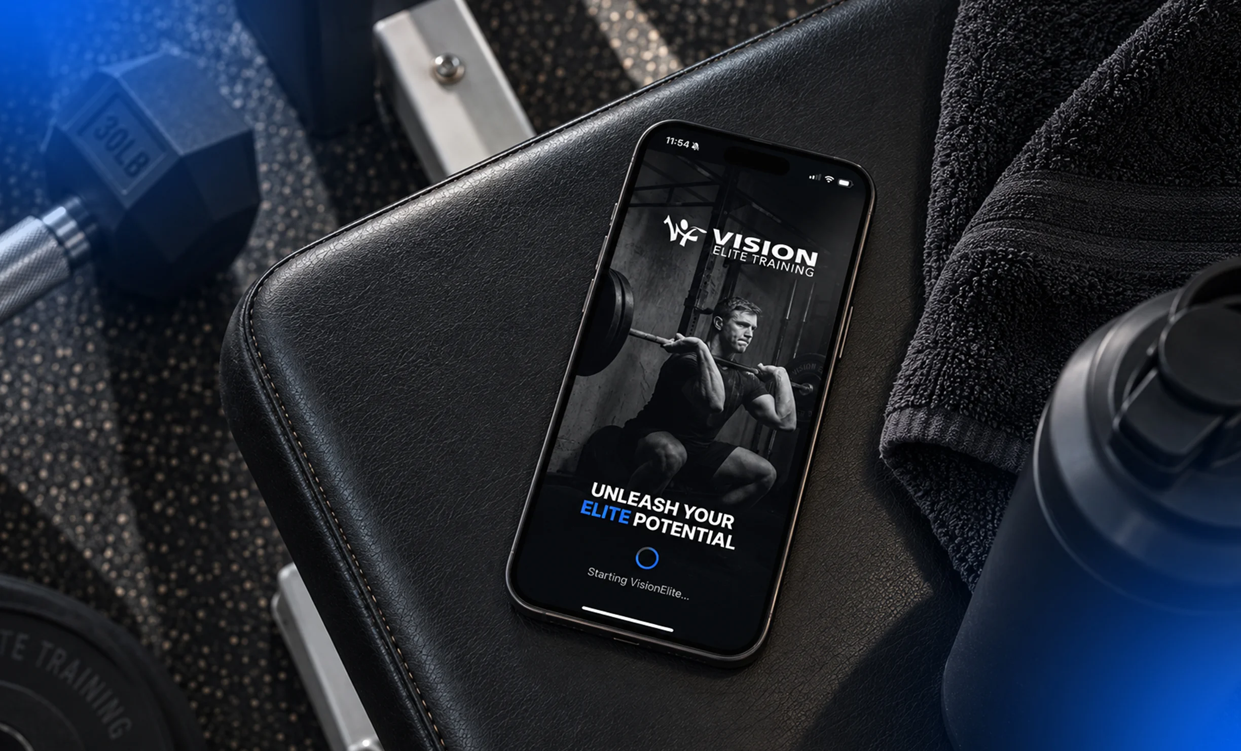 Vision Elite Training App displayed on a smartphone in a gym setting